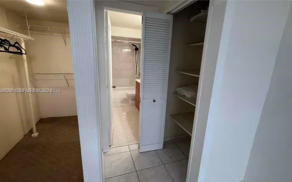 a view of an empty walk in closet