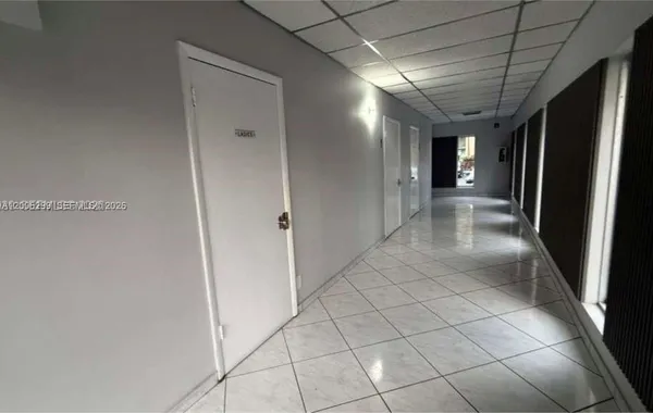 a bathroom with a shower and a door
