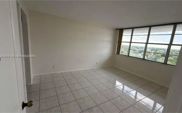 a view of an empty room and window