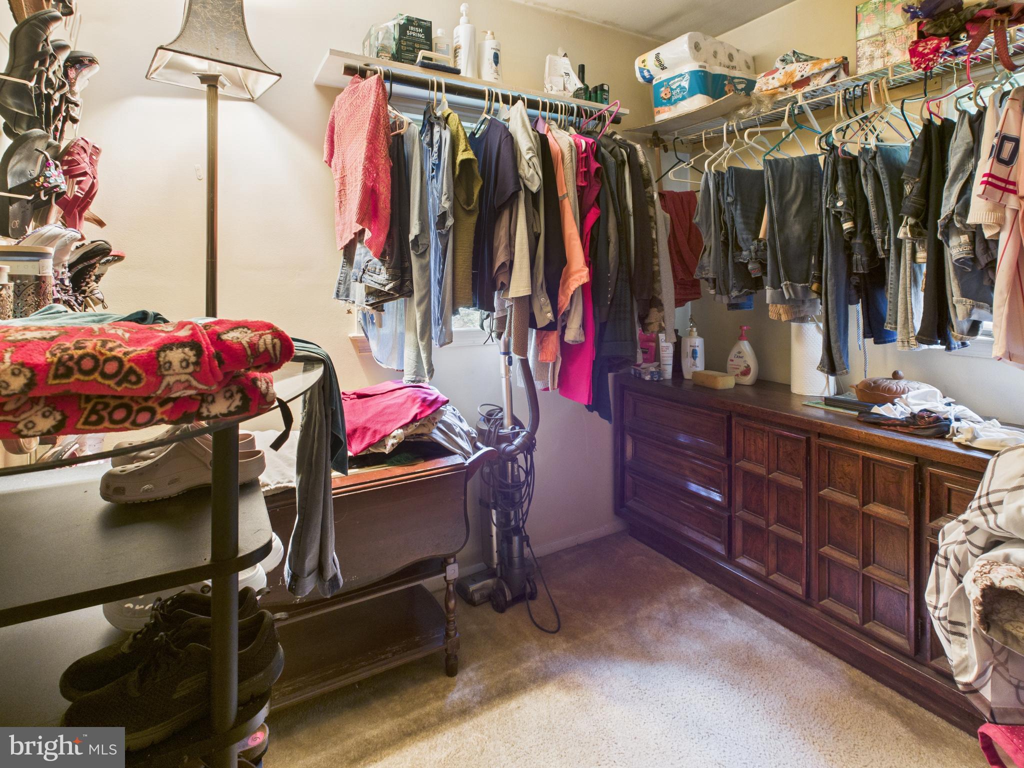7709 Brooklyn Bridge Road Laurel, MD 20707 - Photo 11 of 23 a view of walk in closet with clothes and shoes
