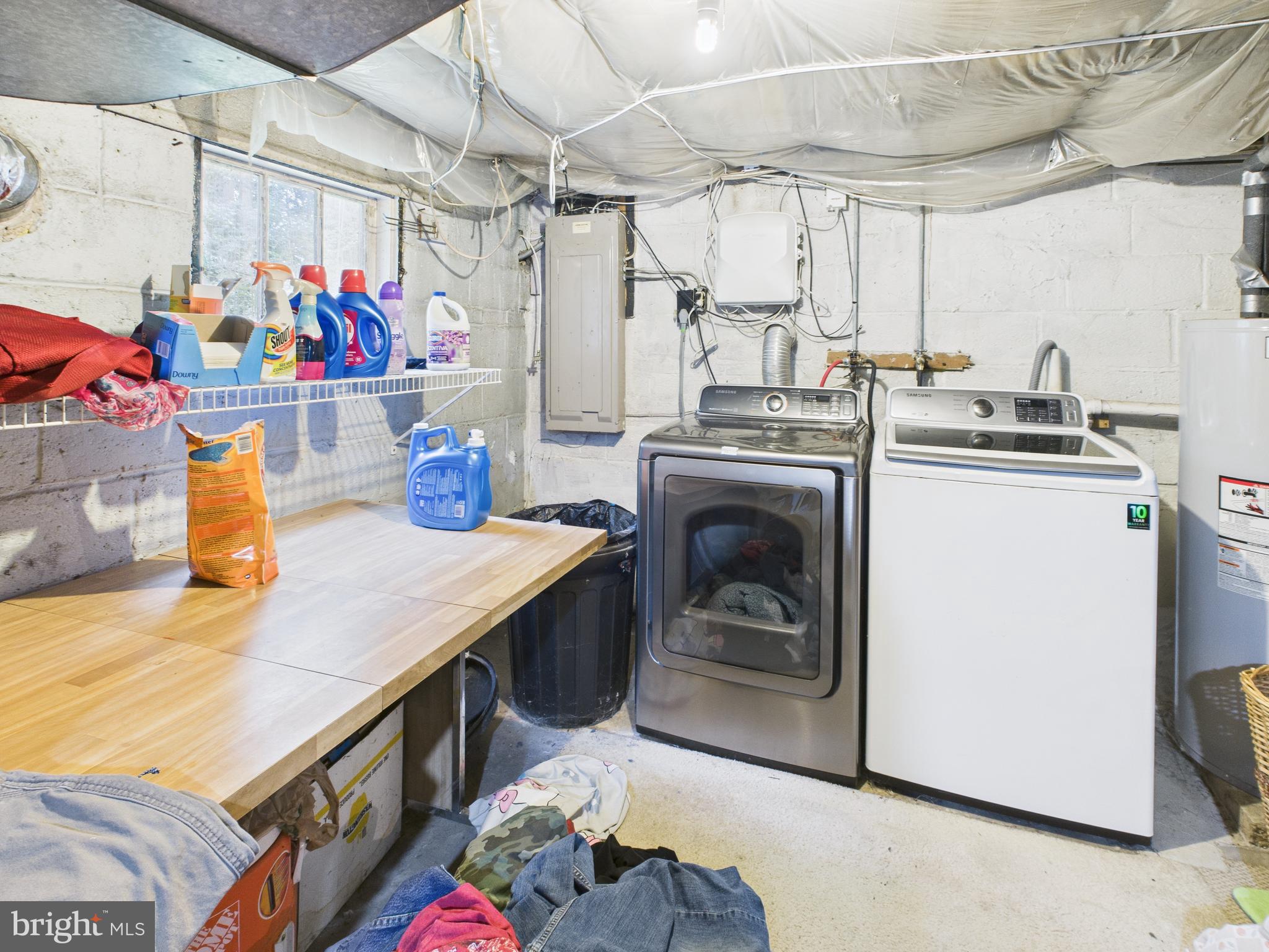 7709 Brooklyn Bridge Road Laurel, MD 20707 - Photo 12 of 23 a utility room with stainless steel appliances granite countertop a sink and cabinets