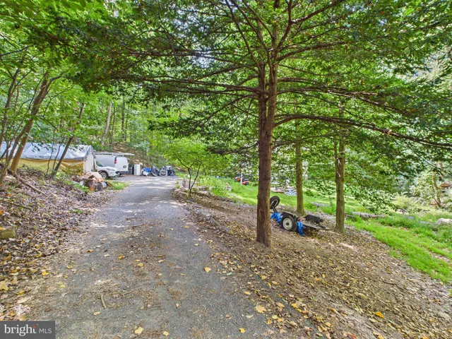 a view of outdoor space with deck and yard