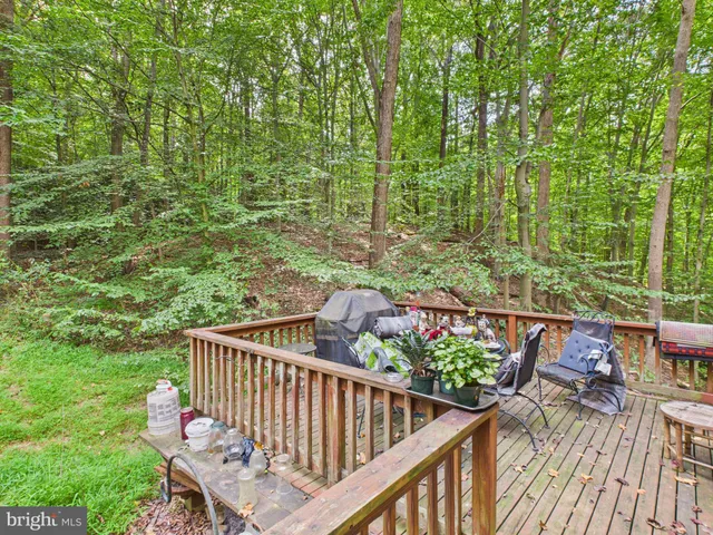 a balcony with wooden floor
