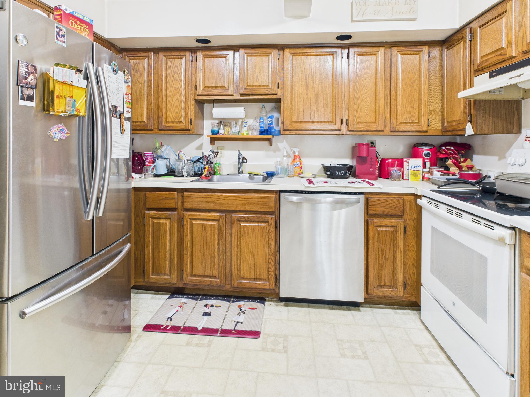 7709 Brooklyn Bridge Road Laurel, MD 20707 - Photo 4 of 23 a kitchen with a sink cabinets and window