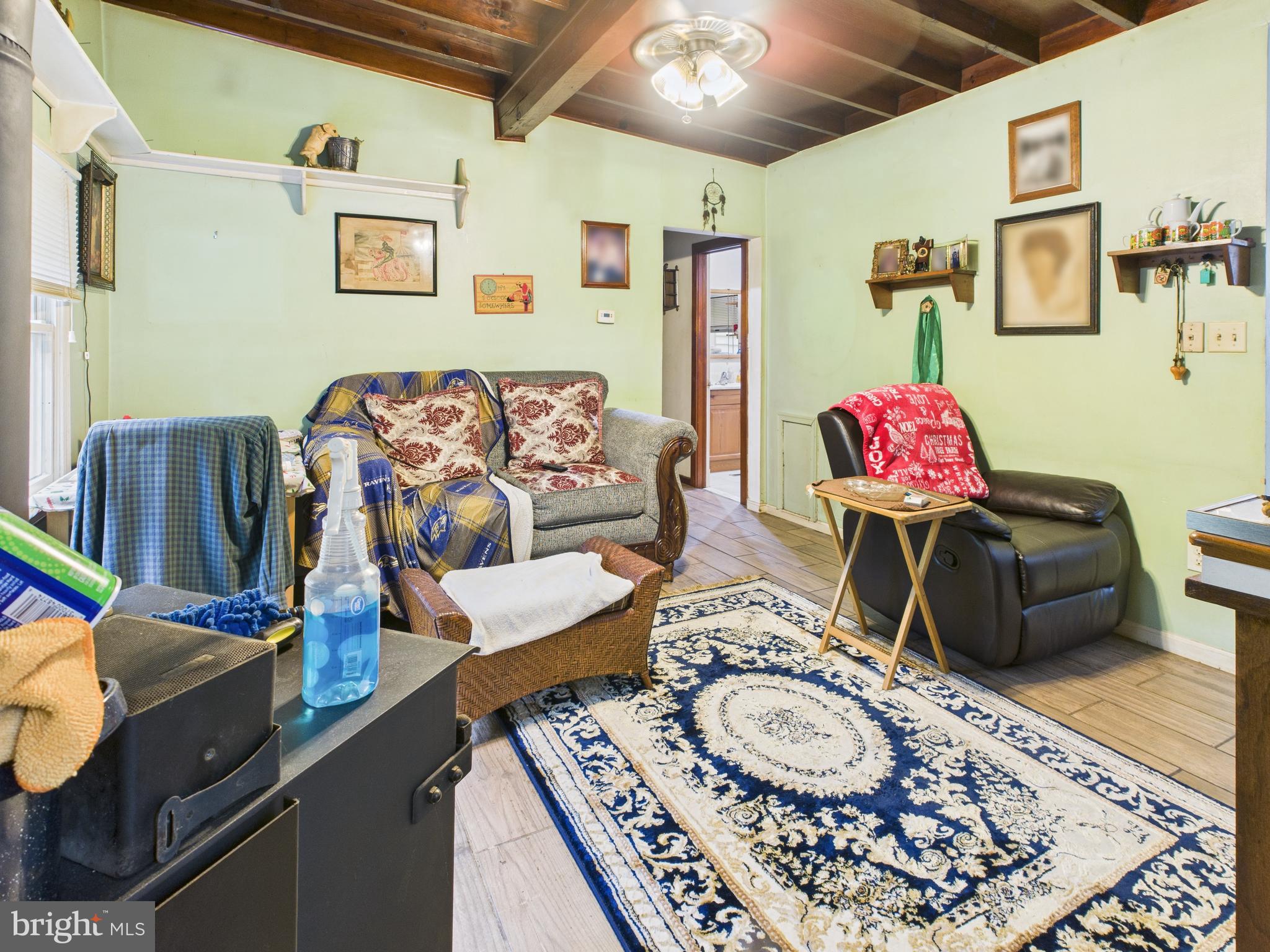 7709 Brooklyn Bridge Road Laurel, MD 20707 - Photo 6 of 23 a living room with furniture and a wooden floor