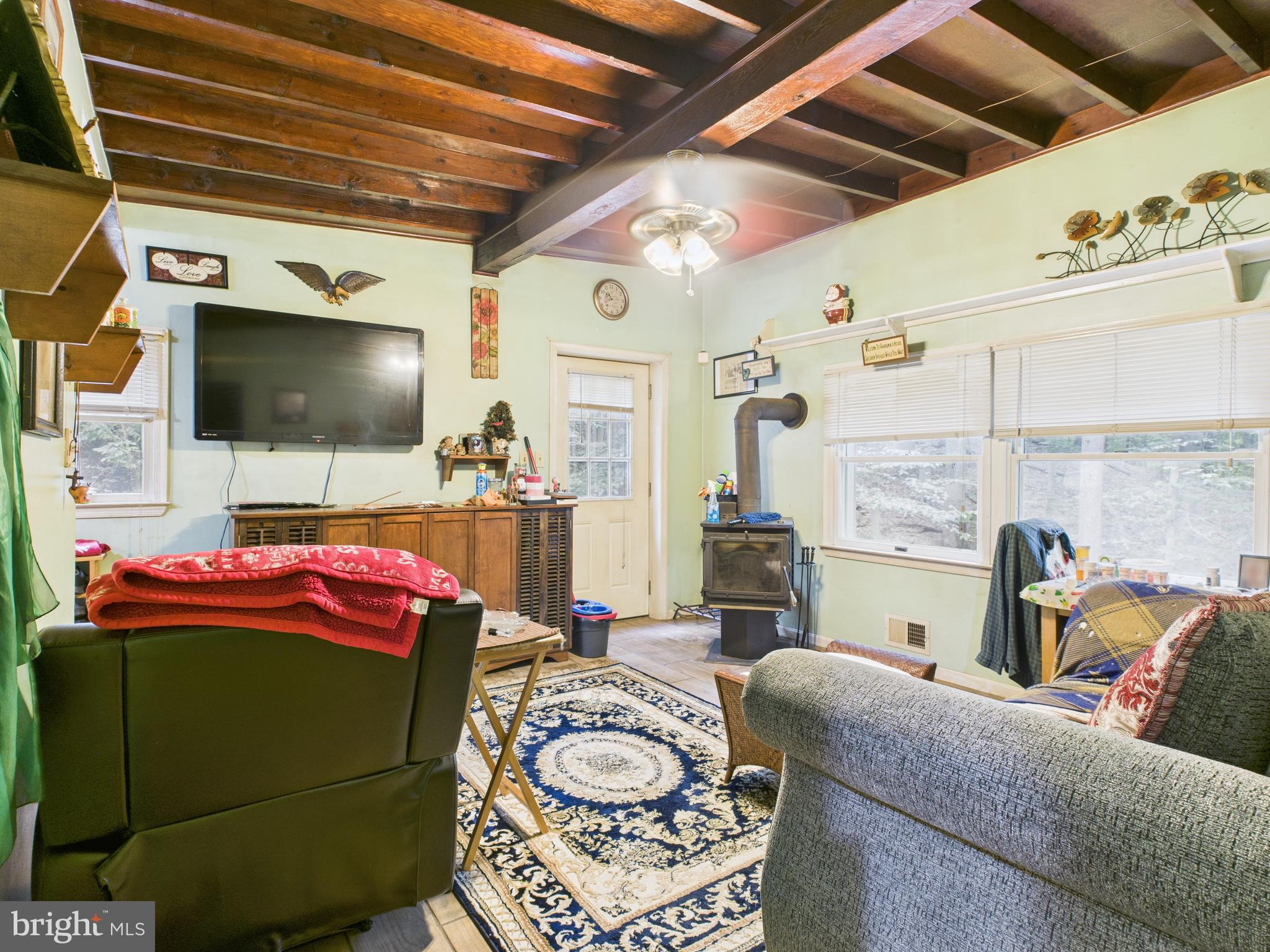 7709 Brooklyn Bridge Road Laurel, MD 20707 - Photo 7 of 23 a living room with furniture and a flat screen tv