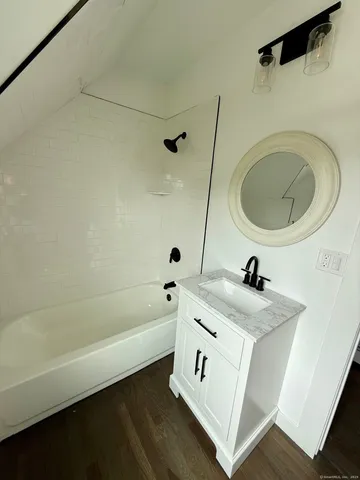 a bathroom with a sink a toilet and a bathtub