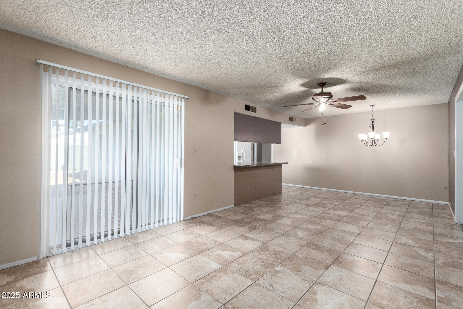 4740 West Bloomfield Road Glendale, AZ 85304 - Photo 9 of 34 a view of a room with a ceiling fan and window