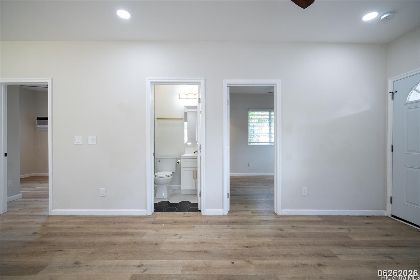 87-1409 Akowai Road Waianae, HI 96792 - Photo 11 of 25 a view of empty room with wooden floor and fan