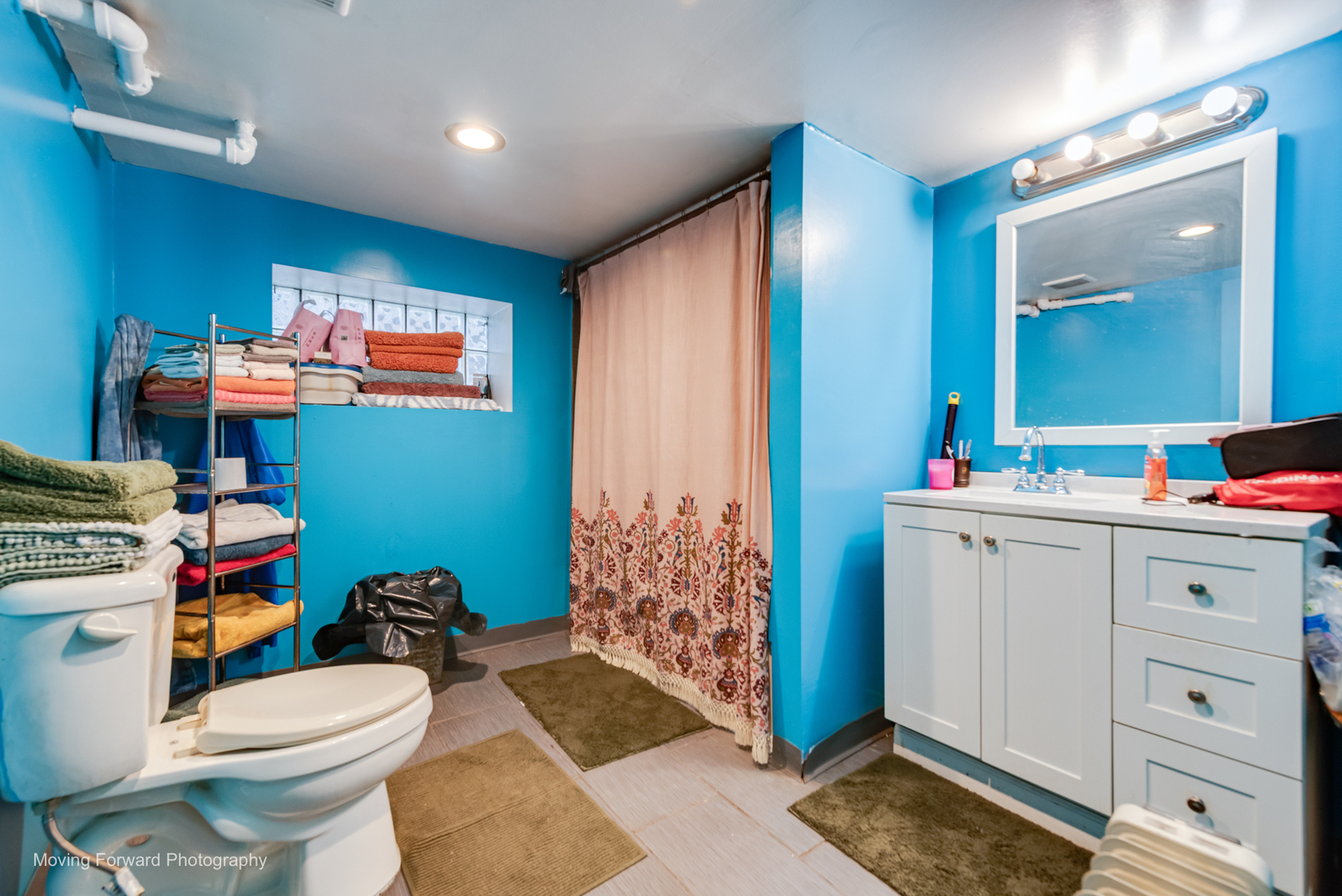 8213 South Indiana Avenue Chicago, IL 60619 - Photo 23 of 25 a bathroom with a sink a toilet and shower