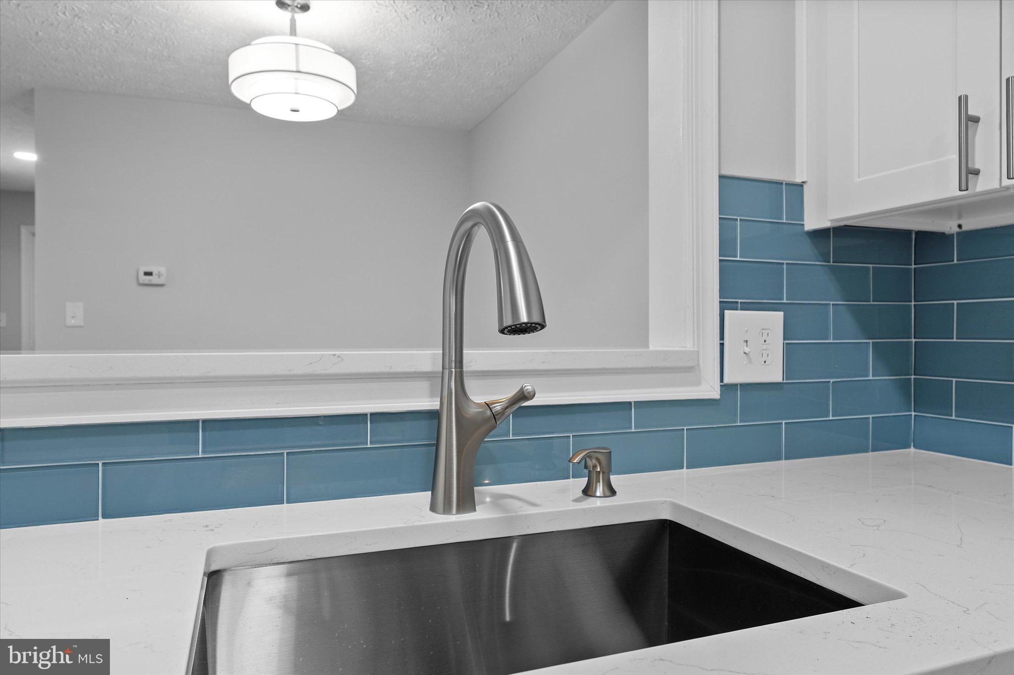 2245 Hunter's Run Drive Reston, VA 20191 - Photo 18 of 47 Quartz Counters & Glass Tile Backsplash