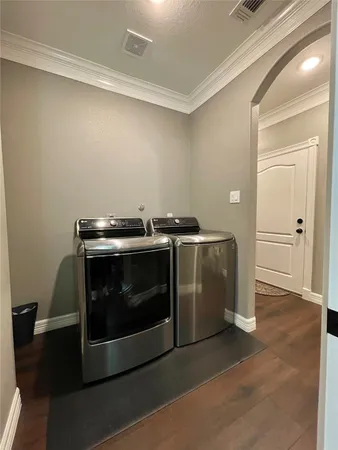 a bed room with a bed mirror and couch