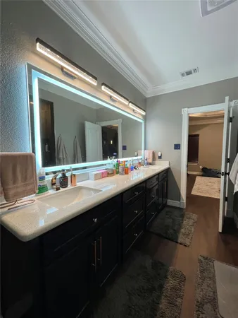 a bedroom with bed and flat screen tv