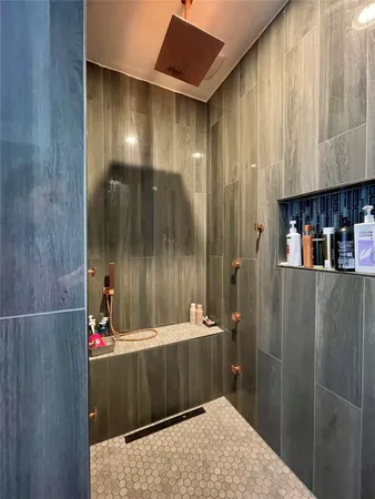 a spacious bathroom with a double vanity sink and a mirror