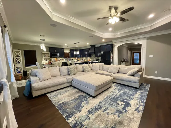 a view of a house with swimming pool and sitting area