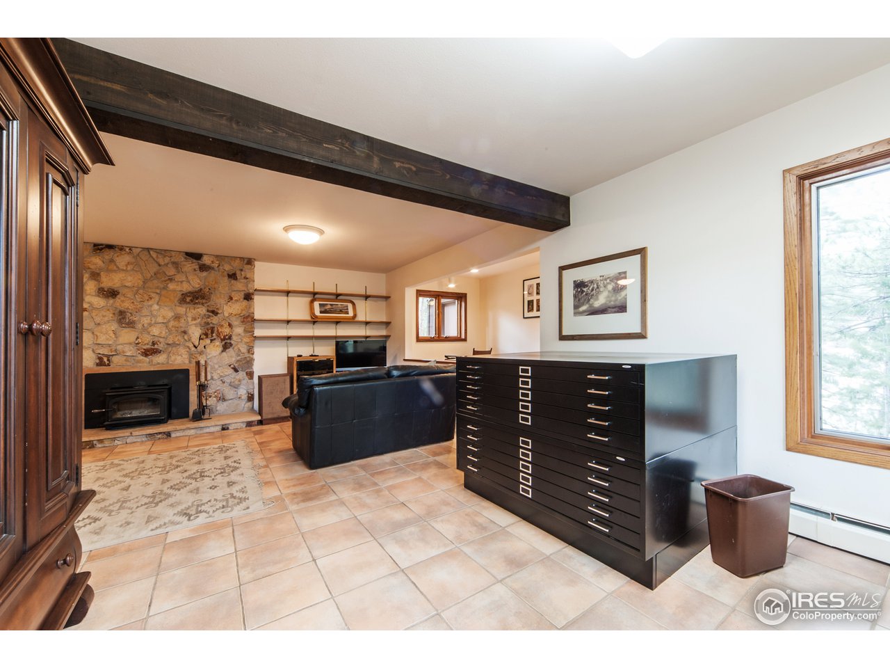 229 Kelly Road East Boulder, CO 80302 - Photo 21 of 25 a kitchen with a refrigerator and a wooden cabinets