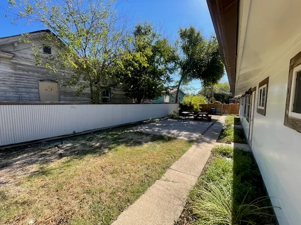 a view of swimming pool with a yard