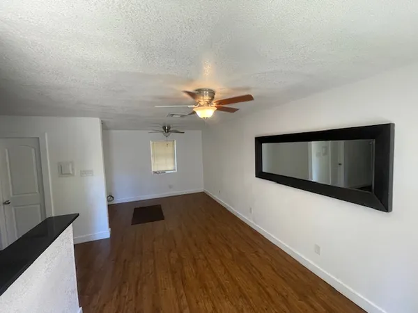 a view of a livingroom with wooden floor