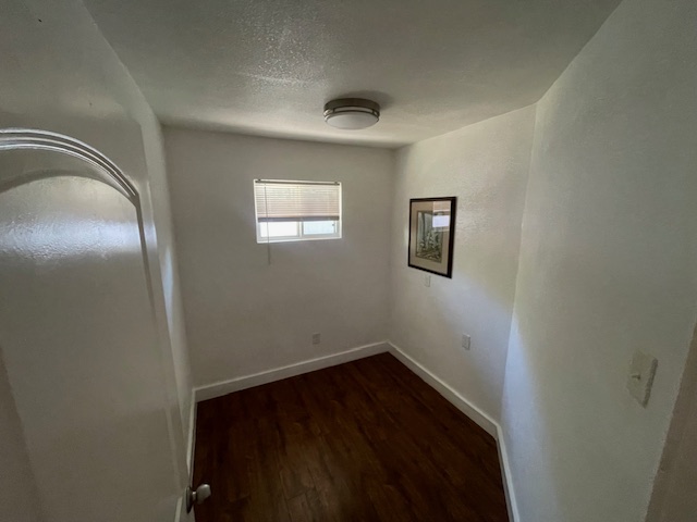 1113 East 3rd Street, Unit A Austin, TX 78702 - Photo 6 of 12 a view of an empty room with wooden floor