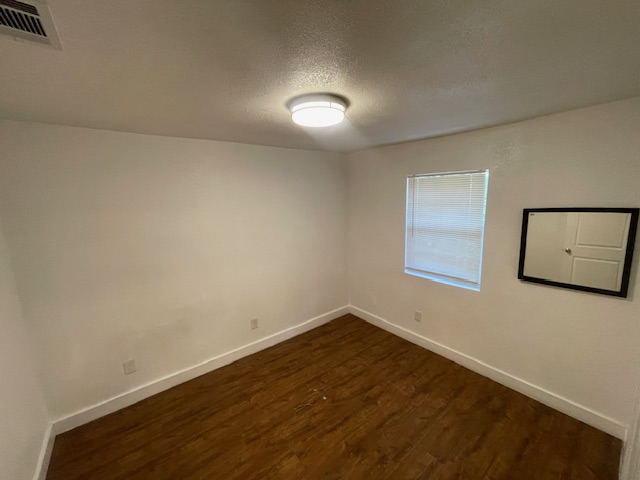 1113 East 3rd Street, Unit A Austin, TX 78702 - Photo 8 of 12 wooden floor in an empty room