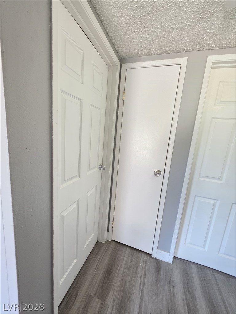 1089 East Desert Inn Road, Unit 3 Las Vegas, NV 89109 - Photo 11 of 15 Clean, new flooring highlights this entry, featuring crisp white doors and neutral walls.