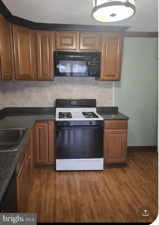 a kitchen with a stove and a microwave