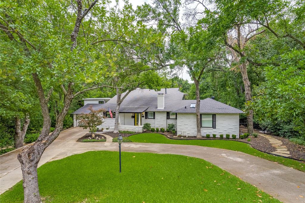 204 Varsity Circle Arlington, TX 76013 - Photo 1 of 1 a front view of a house with a yard table and chairs