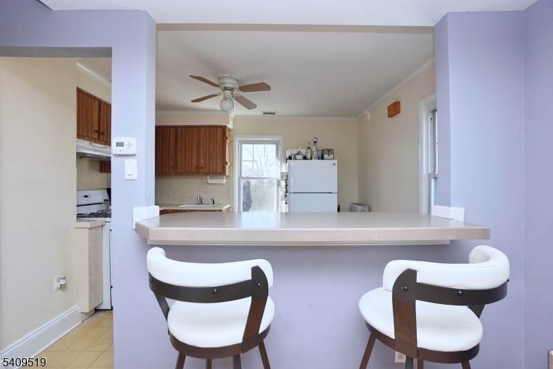 103 Orchard Street, Unit 2 Summit, NJ 07901 - Photo 9 of 17 a dining room with furniture and wooden floor