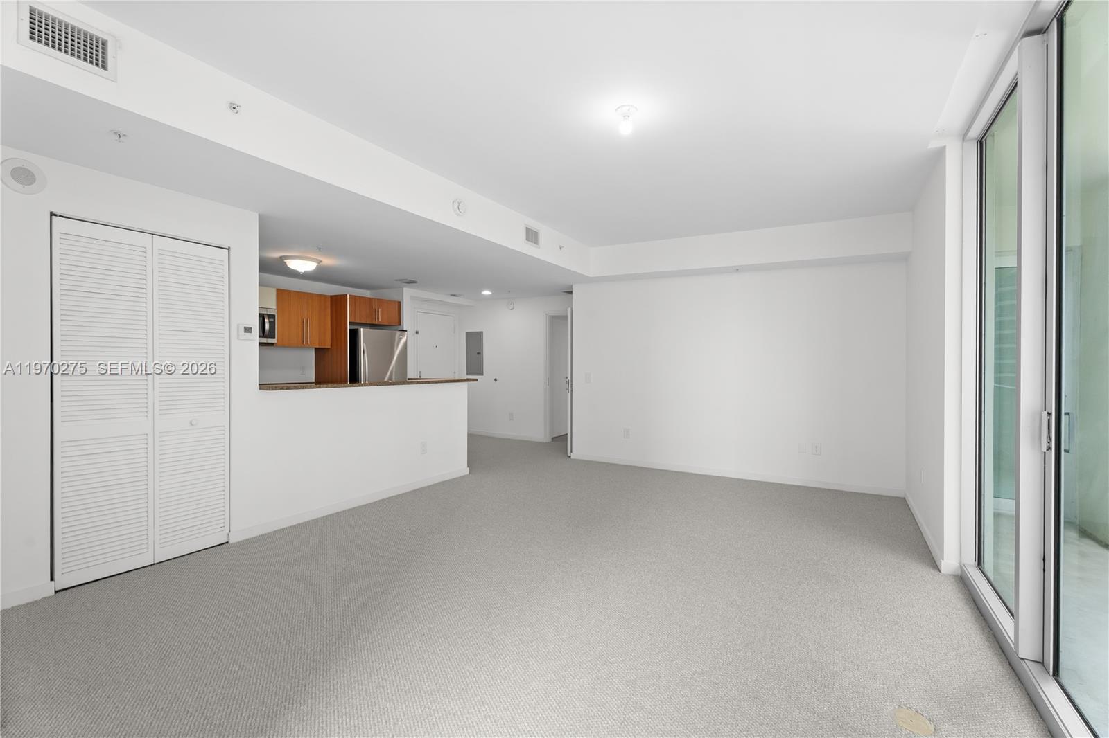 300 South Biscayne Boulevard, Unit T2602 Miami, FL 33131 - Photo 5 of 17 an empty room with a kitchen