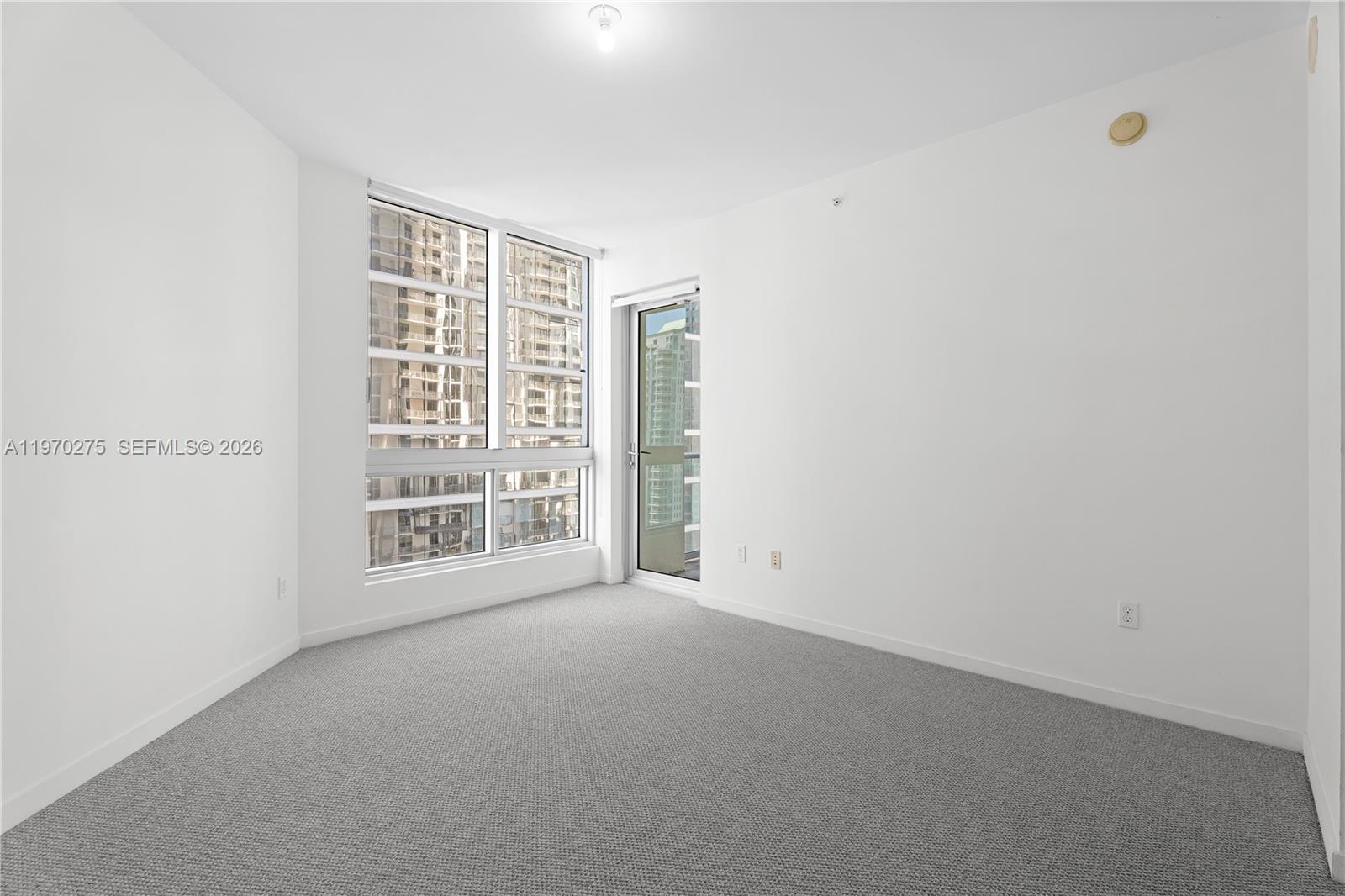300 South Biscayne Boulevard, Unit T2602 Miami, FL 33131 - Photo 9 of 17 a view of an empty room with a window