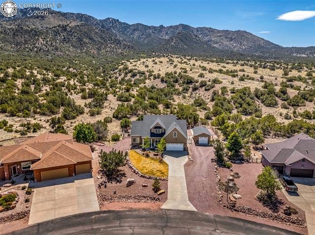 182 Raptor Court Canon City, CO 81212 - Photo 43 of 50 Behind the home the property backs directly to BLM land, providing added privacy with no immediate rear neighbors and a peaceful natural backdrop. This combination of extended usable space and protected open land behind is a rare find, especially within Dawson Ranch.