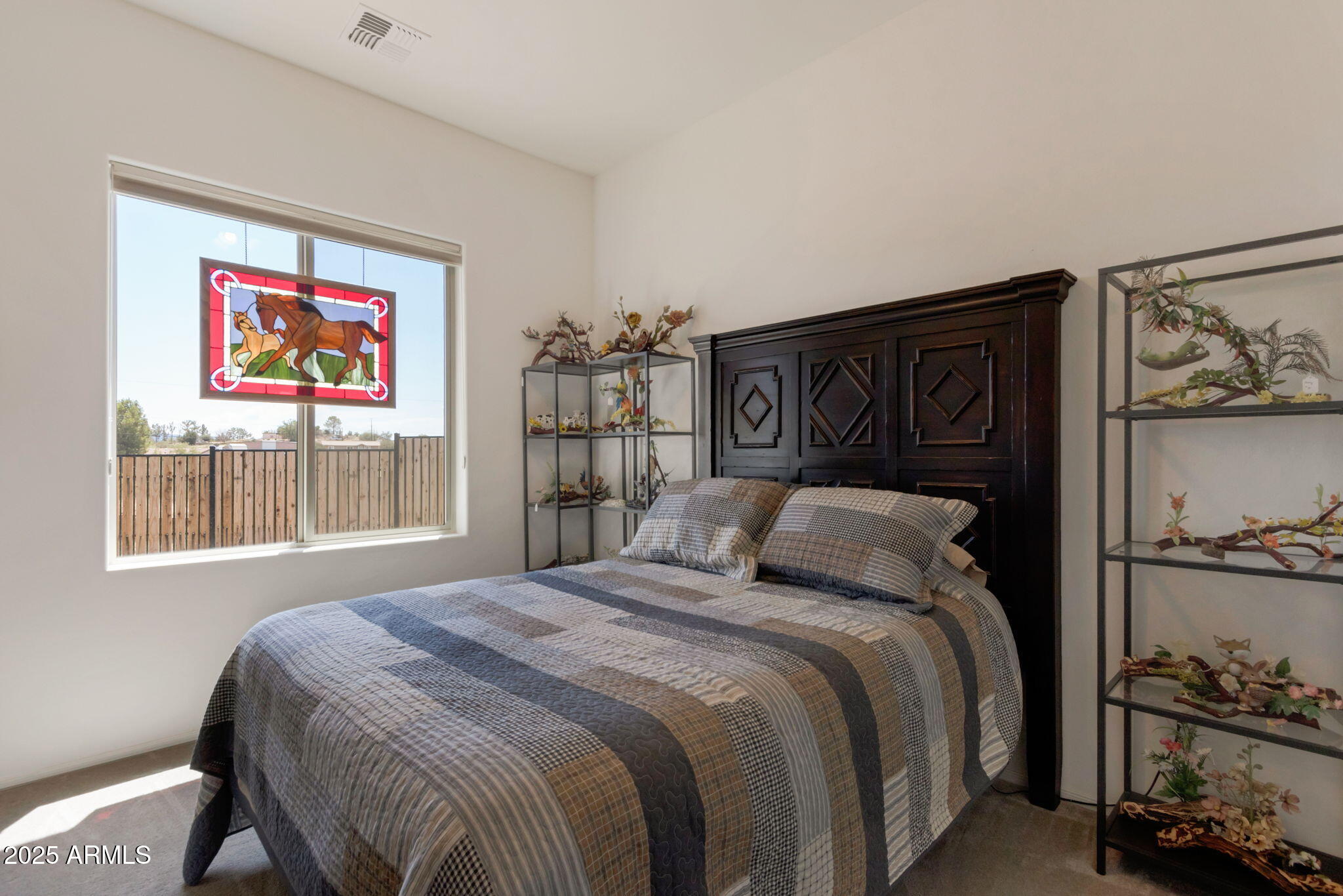 6025 North Hanover Court Rimrock, AZ 86335 - Photo 16 of 30 a bedroom with a bed and a window