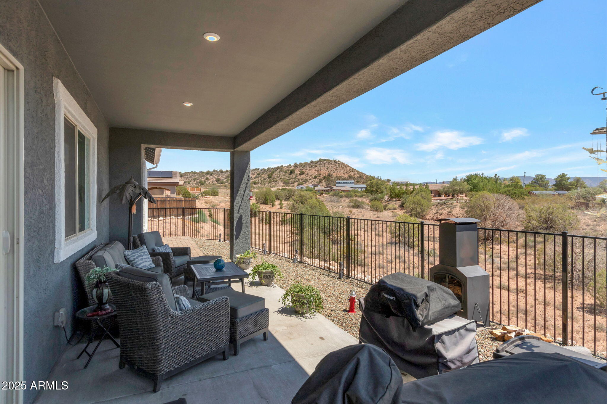 6025 North Hanover Court Rimrock, AZ 86335 - Photo 22 of 30 a living room with furniture tv and a floor to ceiling window