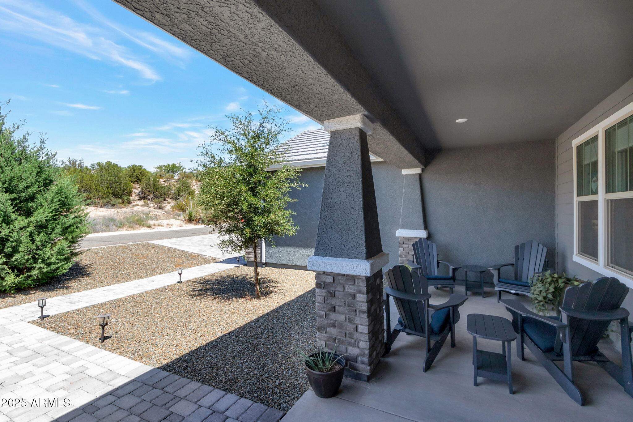 6025 North Hanover Court Rimrock, AZ 86335 - Photo 3 of 30 a view of a porch with chairs and potted plants