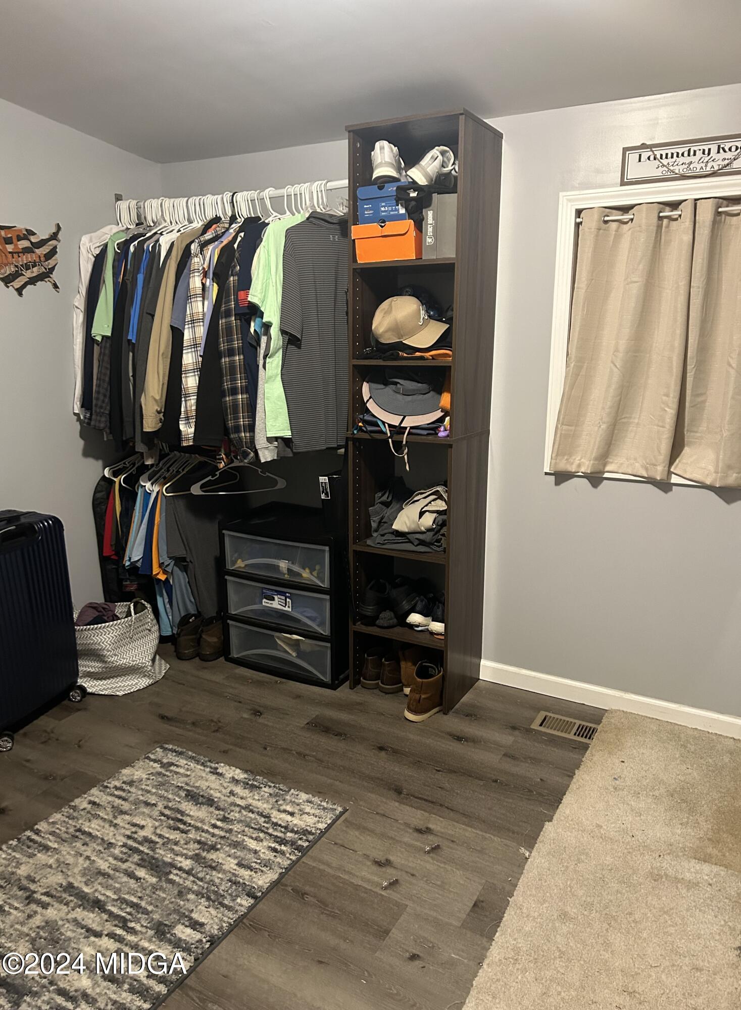 11 Pope Road Roberta, GA 31078 - Photo 13 of 15 a view of walk in closet with clothes and shoes