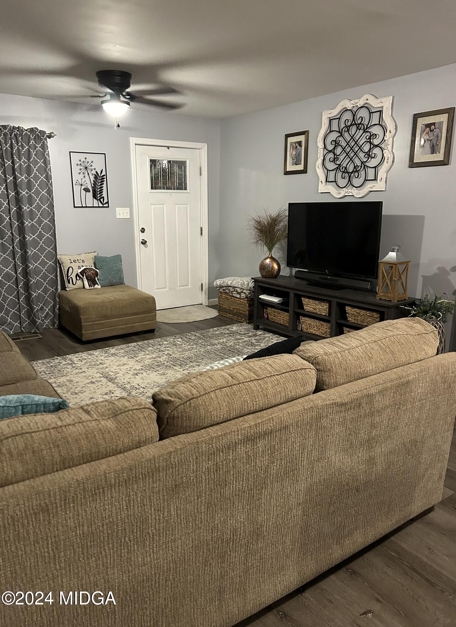 11 Pope Road Roberta, GA 31078 - Photo 4 of 15 a living room with furniture and a flat screen tv