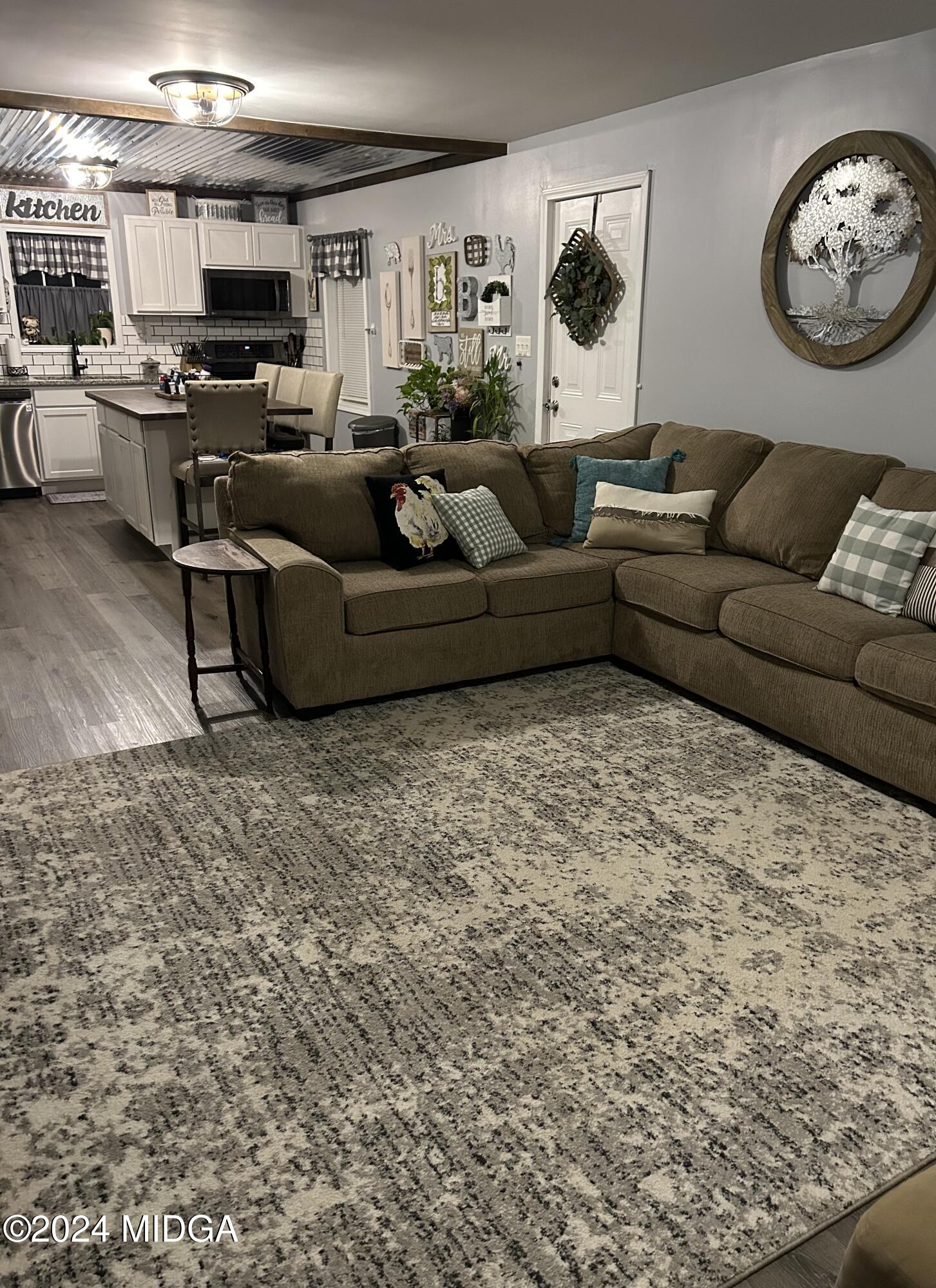11 Pope Road Roberta, GA 31078 - Photo 5 of 15 a living room with furniture and a flat screen tv