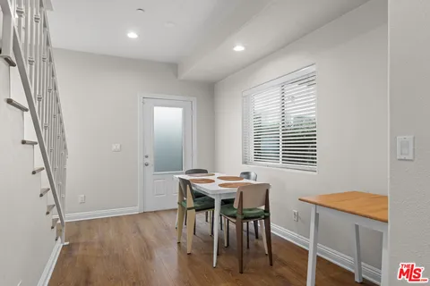 a view of a livingroom with furniture window and wooden floor