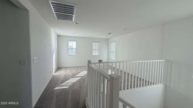 a view of a hallway with windows