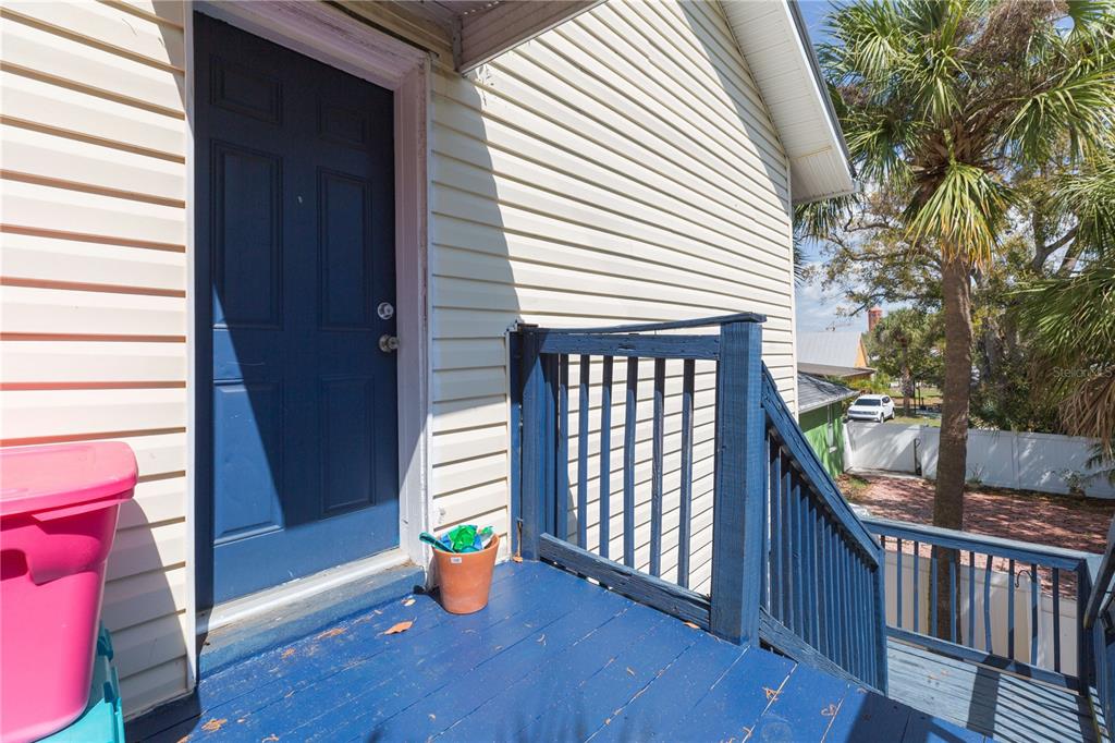 2322 West Cherry Street Tampa, FL 33607 - Photo 28 of 36 a view of a porch with wooden floor and fence and a wooden deck