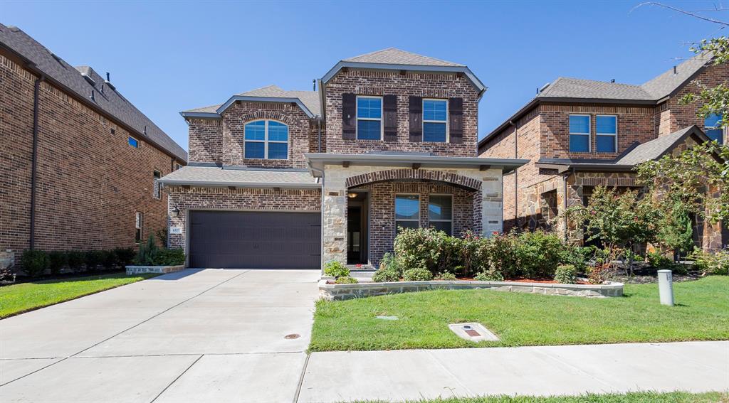 6337 Saddlebrook Way Irving, TX 75039 - Photo 1 of 40 a front view of a house with a garden