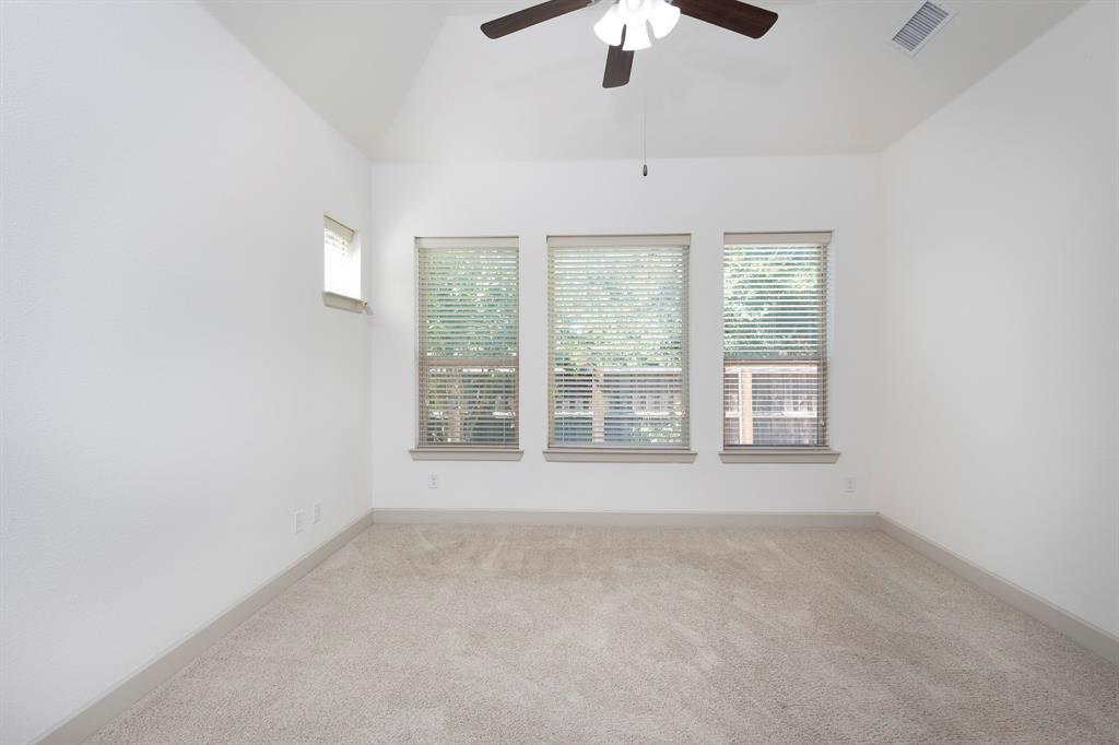 6337 Saddlebrook Way Irving, TX 75039 - Photo 20 of 40 an empty room with a empty space and windows