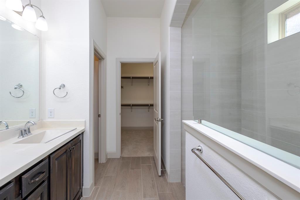 6337 Saddlebrook Way Irving, TX 75039 - Photo 21 of 40 a bathroom with a sink and a mirror
