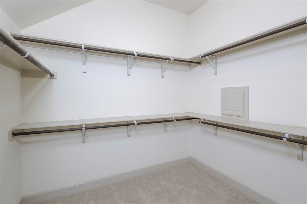 6337 Saddlebrook Way Irving, TX 75039 - Photo 23 of 40 a view of an empty walk in closet