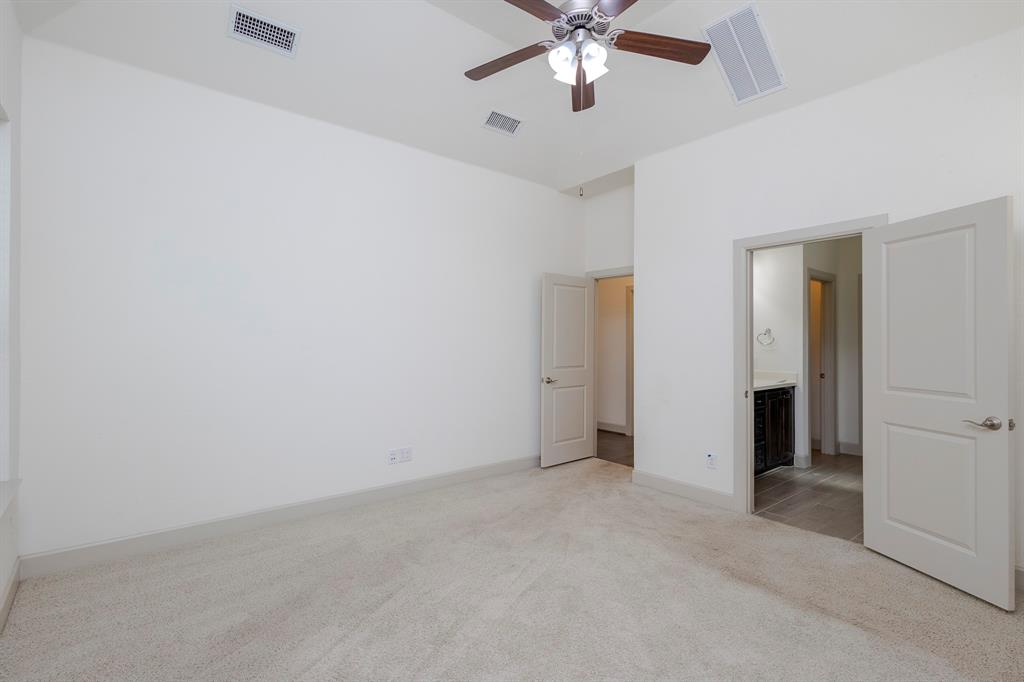 6337 Saddlebrook Way Irving, TX 75039 - Photo 24 of 40 an empty room with a chandelier fan