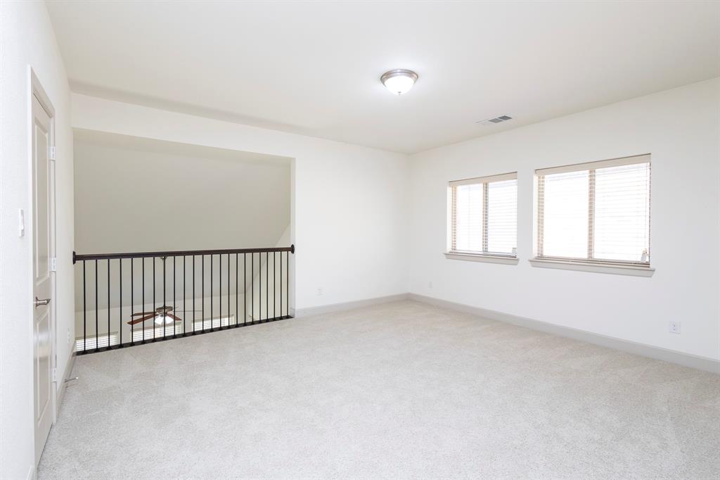 6337 Saddlebrook Way Irving, TX 75039 - Photo 28 of 40 an empty room with windows