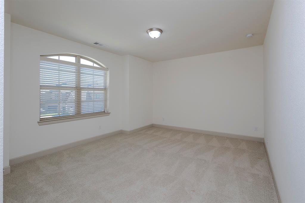 6337 Saddlebrook Way Irving, TX 75039 - Photo 30 of 40 an empty room with windows