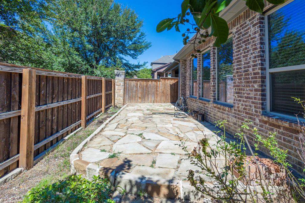 6337 Saddlebrook Way Irving, TX 75039 - Photo 38 of 40 a view of a backyard with pathway