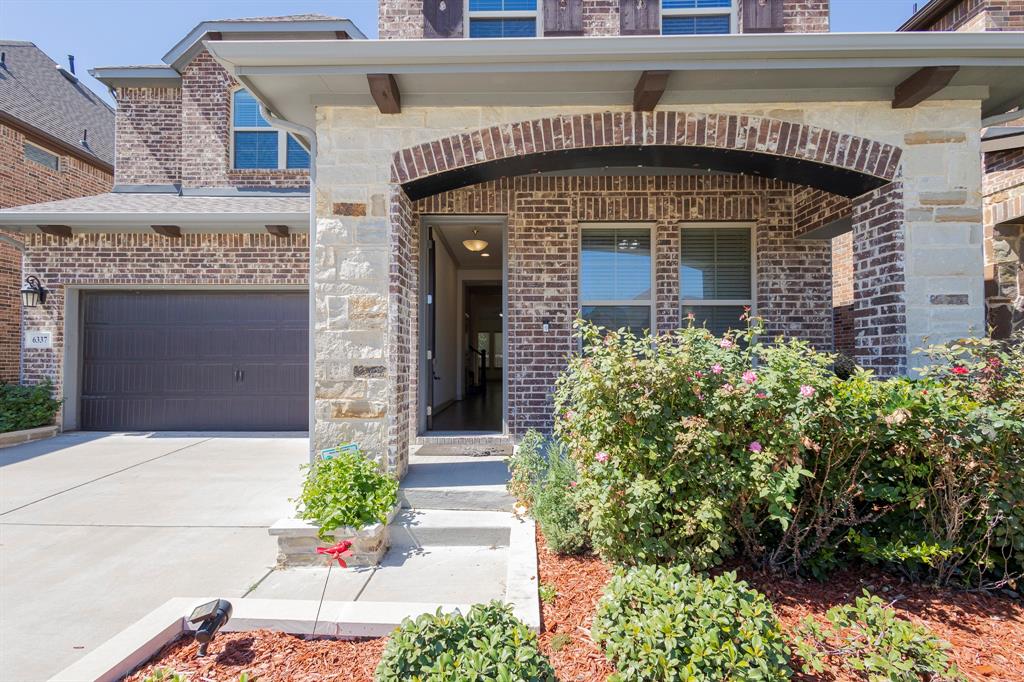6337 Saddlebrook Way Irving, TX 75039 - Photo 4 of 40 a front view of a house with a garden