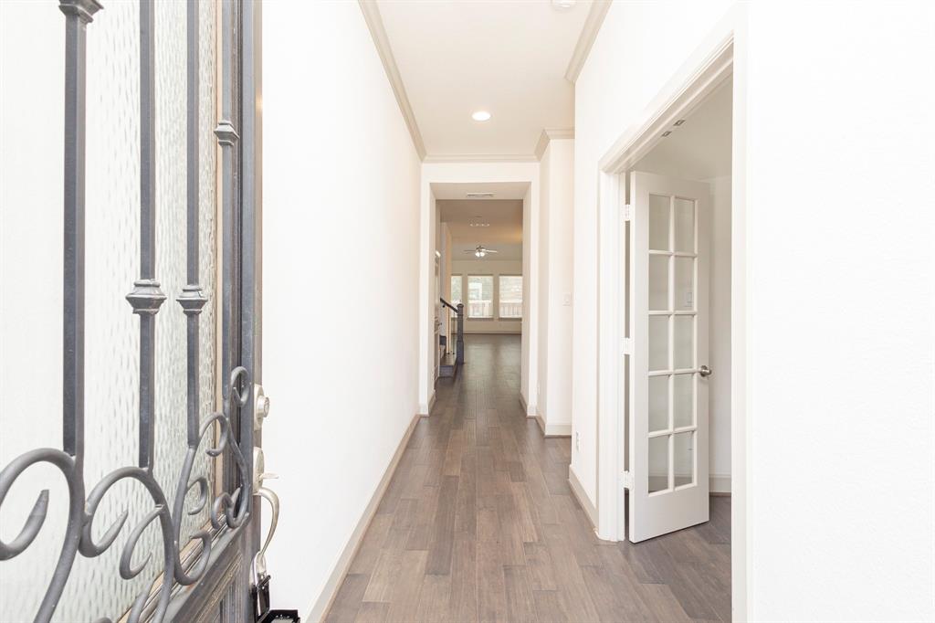 6337 Saddlebrook Way Irving, TX 75039 - Photo 5 of 40 a view of a hallway with wooden floor